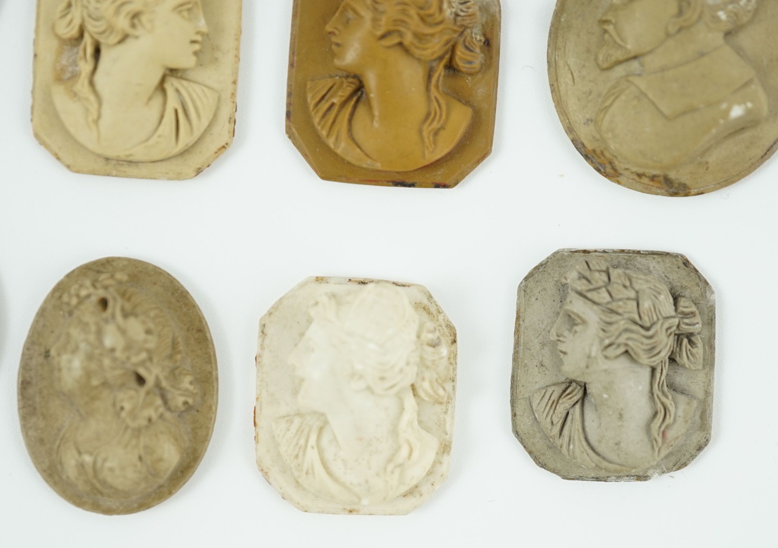 An antique hardstone cameo of Hermes and nine Italian lava cameos largest 2.75 x 2.25cm.